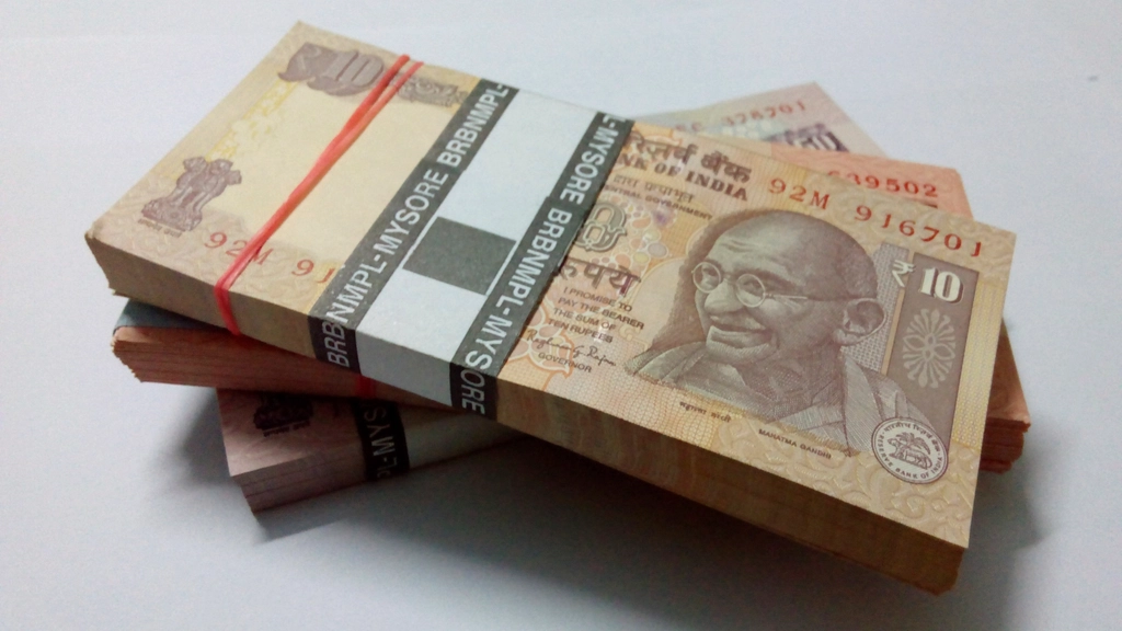 rupee slides past 93
